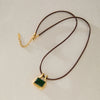 Women's Geometric Stainless Steel Pendant Necklace With Black Waxed Rope Choker And Pvd Vacuum Gold Plated Finish