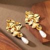 Women's Gold Plated Metal Floral Petal Tassel Earrings With Geometric Water Drop Pearl Design
