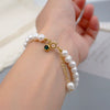Women's Handmade Freshwater Pearl Beaded Bracelet With Geometric Design And Small Pendant