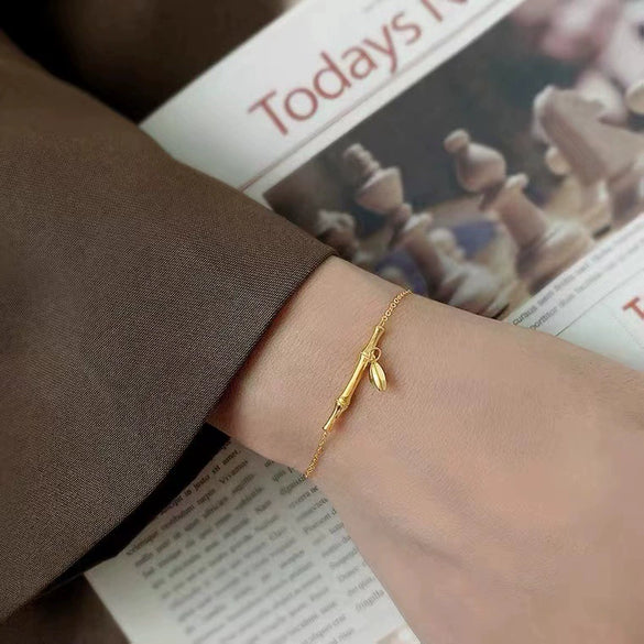 Women's Highrise Bamboo Ball Chain Titanium Steel Bracelet With Gold Inlaid Geometric Design