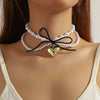 Women's Imitation Pearls And Organic Glass Heart And Bow Shaped Pendant Necklace With Electroplating