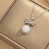 Women's Light Luxury Microinlaid Bow Pearl Pendant Titanium Steel Necklace With Electroplating