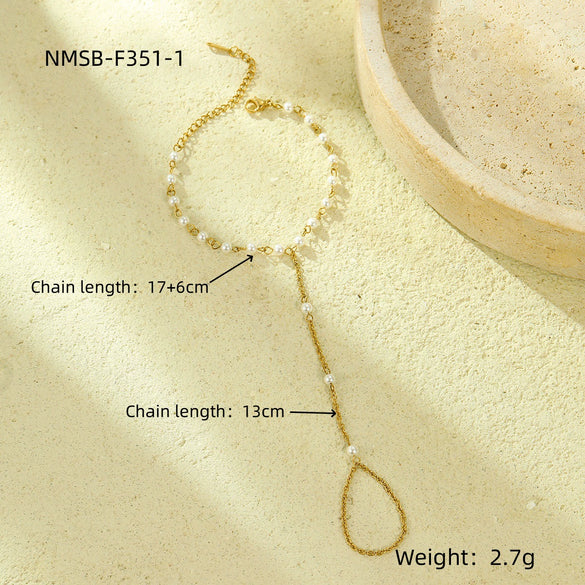 Women's Light Luxury Style Stainless Steel And 18K Gold Hand Jewelry With Pearl Bracelet And Finger Chain Integrated