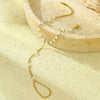Women's Light Luxury Style Stainless Steel And 18K Gold Hand Jewelry With Pearl Bracelet And Finger Chain Integrated