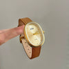 Women's Metal Case Genuine Leather Strap Oval Quartz Watch With Simple Temperament And Light Luxury Design