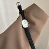 Women's Metal Case Genuine Leather Strap Oval Quartz Watch With Simple Temperament And Light Luxury Design