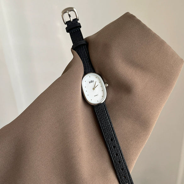 Women's Metal Case Genuine Leather Strap Oval Quartz Watch With Simple Temperament And Light Luxury Design