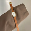 Women's Metal Case Genuine Leather Strap Oval Quartz Watch With Simple Temperament And Light Luxury Design