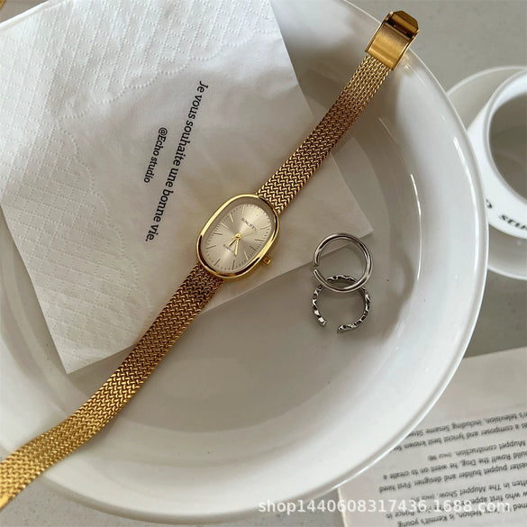Women's Metal Case Ordinary Glass Mirror Oval Dial Retro Artistic Golden Steel Strap Watch