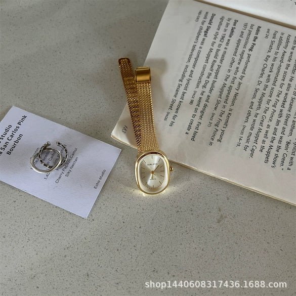 Women's Metal Case Ordinary Glass Mirror Oval Dial Retro Artistic Golden Steel Strap Watch