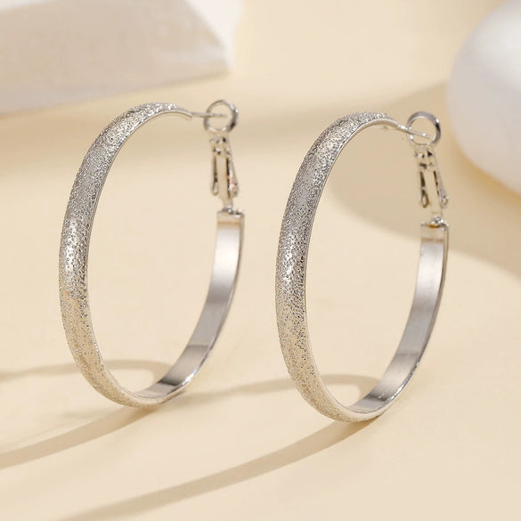 Women's Metal Hoop Earrings With Matte Finish Electroplated Surface And Bold Oversized Circular Design