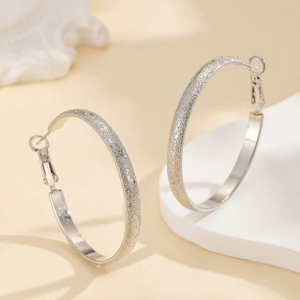 Women's Metal Hoop Earrings With Matte Finish Electroplated Surface And Bold Oversized Circular Design
