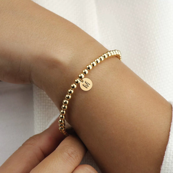 Women's Minimalist Copper Bead Bracelet With Gold Electroplated Letter Charms Round Disc Pendant And Elastic Beaded String