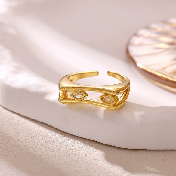 Women's Minimalist Geometric Bow Ring In Goldplated Copper With A Wideface Design And Diamondencrusted Detail