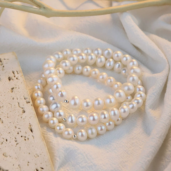 Women's Natural Freshwater Pearl Nearly Round Elastic Bracelet With Silverplated Beads And Highend Design