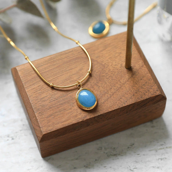 Women's Oval Aquamarine Pendant Necklace In Titanium Steel With Snake Bone Chain And Gold Plated Geometric Clavicle Chain Design
