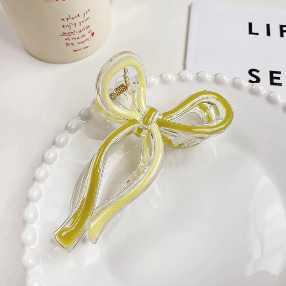 Women's Plastic And Resin Bow Grip Hair Clip With Dripping Oil Design