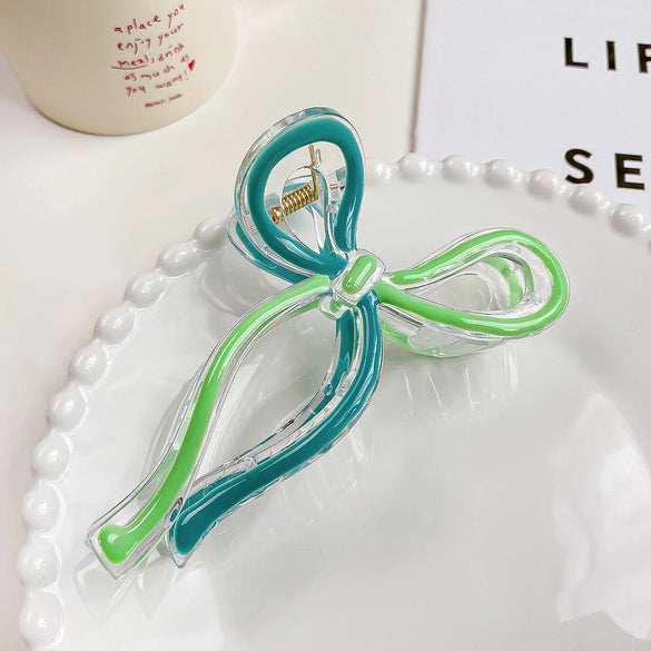 Women's Plastic And Resin Bow Grip Hair Clip With Dripping Oil Design