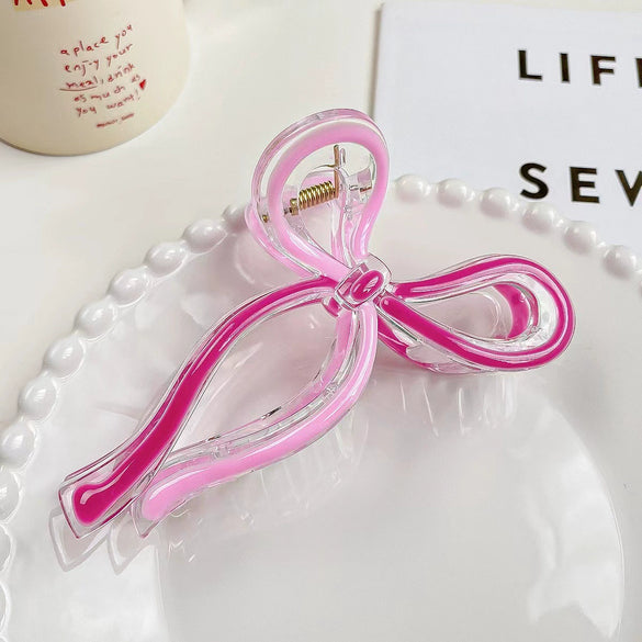 Women's Plastic And Resin Bow Grip Hair Clip With Dripping Oil Design
