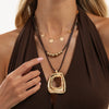 Women's Plated Alloy Geometric Hollow Square Pendant Necklace With Retro Brown Waxed Rope And Beaded Layered Design