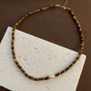 Women's Retro Light Luxury Titanium Steel Tiger Eye Necklace With Geometric Pattern And Electroplating Treatment And Pearl Chain