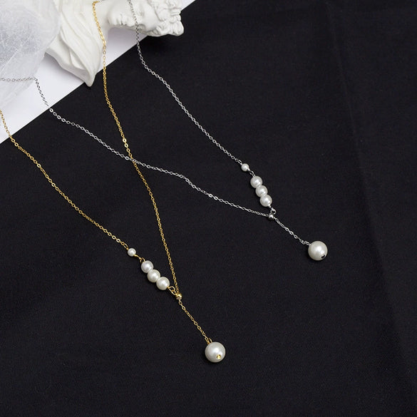 Women's Silver Geometric Imitation Pearl Pendant Necklace With Tassel Detail Cross Chain And Electroplated Light Luxury Design