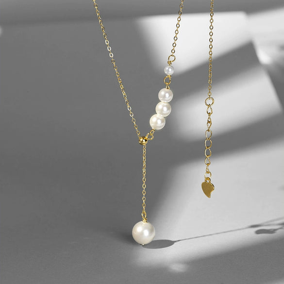 Women's Silver Geometric Imitation Pearl Pendant Necklace With Tassel Detail Cross Chain And Electroplated Light Luxury Design