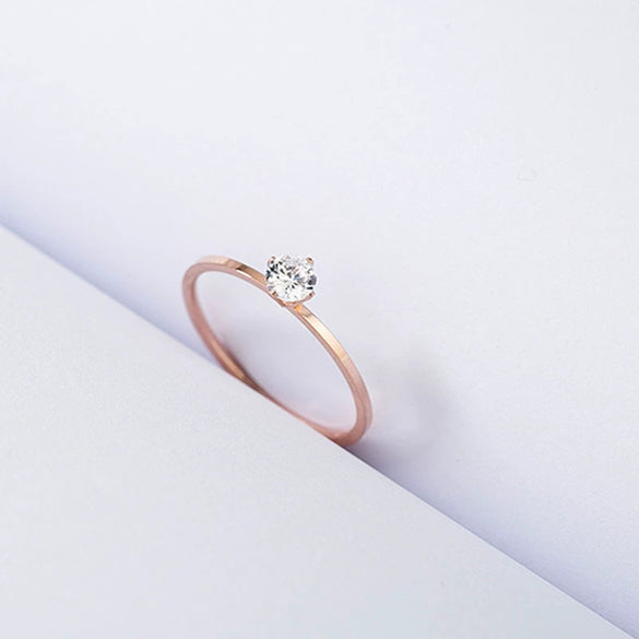 Women's Simple Geometric Stainless Steel Single Stone Ring With Four Claw Setting And Rose Gold Electroplated Finish