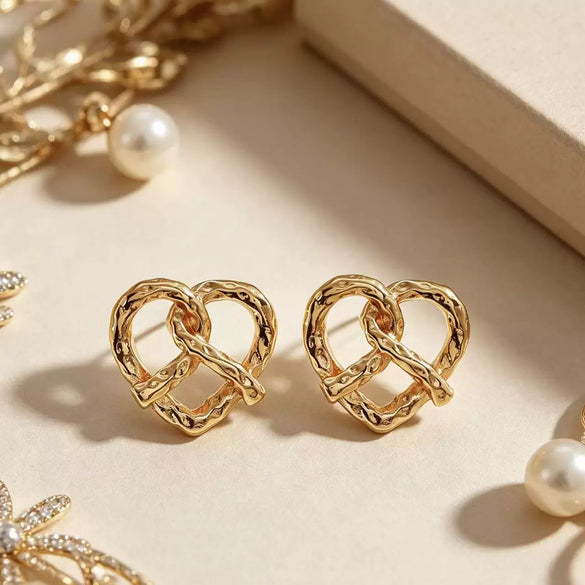 Women's Simple Heart Shaped Knot Earrings In Electroplated Alloy With Steel Ear Needles Fashion Bread Knot Design