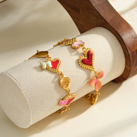 Women's Stainless Steel Bracelet With Heart And Bow Design Pearl And Rhinestone Inlay Oil Drip Finish And Gold Tone Vacuum Plating