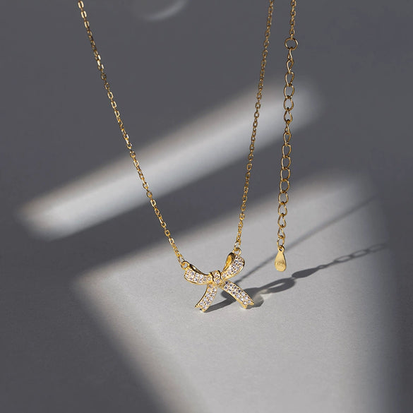 Women's Sterling Silver Bow Pendant Necklace With Electroplated Finish And Cross Chain Elegant Fashion Jewelry