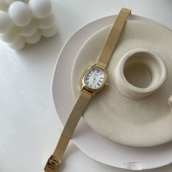 Women's Summer French Retro Alloy Case Ordinary Glass Mirror Oval Thin Band Compact Roman Golden Watch