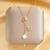 Women's Titanium Steel And Copper Geometric Double Pendant Tassel Four Leaf Flower Necklace With Diamond Treatment
