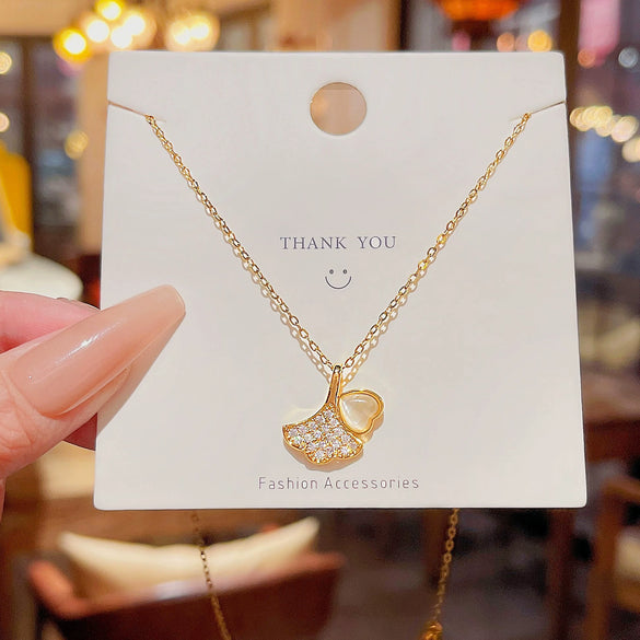 Women's Titanium Steel Ginkgo Leaf Pendant Necklace With Microinlaid Zircon And Geometric Pattern