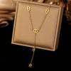Women's Titanium Steel Hollow Oval Tassel Necklace And Bracelet Set Geometric O Chain Electroplated Simple Jewelry